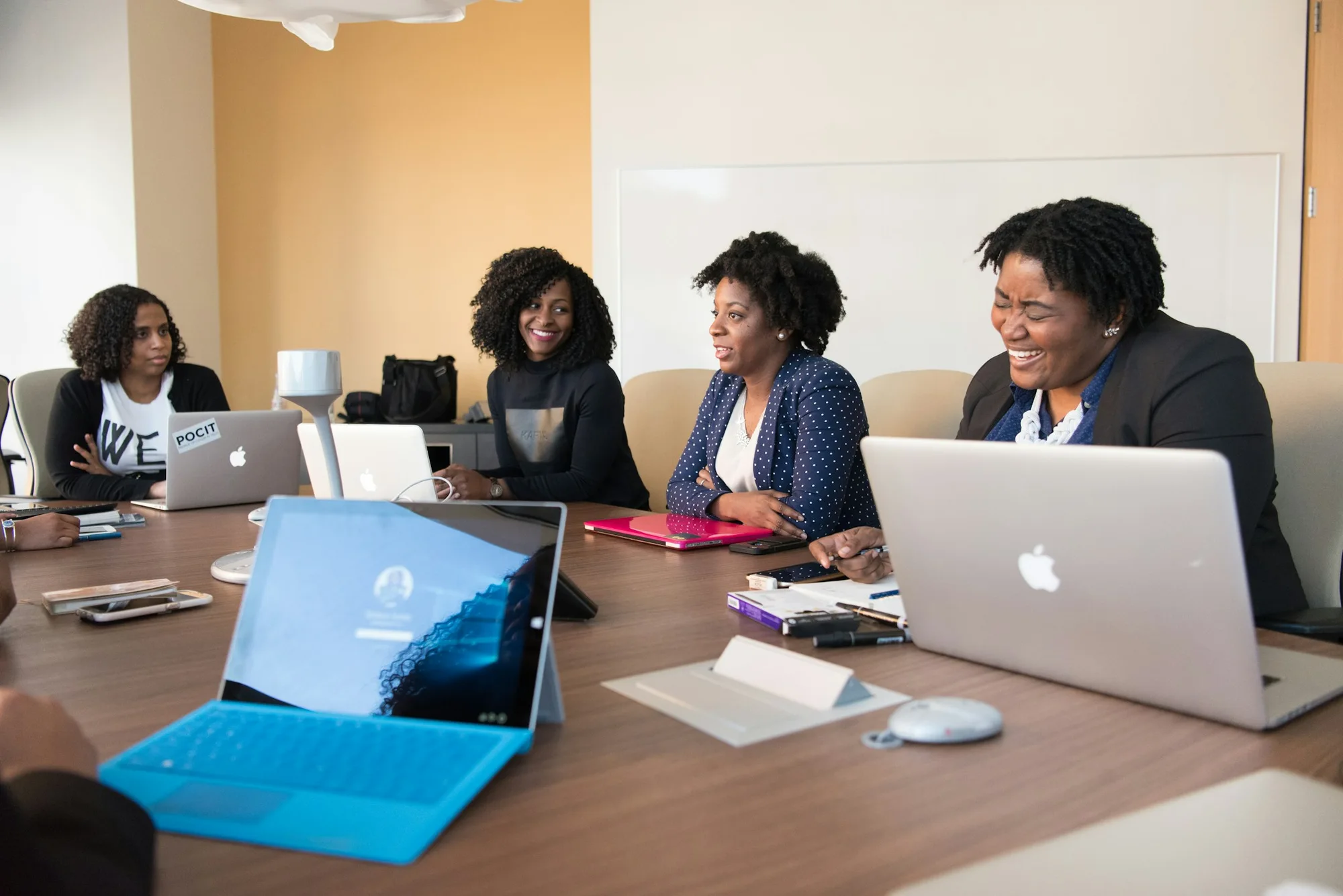 Professionals exchanging ideas around a meeting table